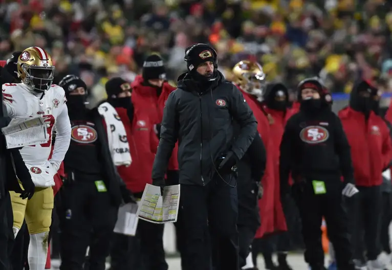 Jan 22, 2022; Green Bay, Wisconsin, USA; San Francisco 49ers head coach Kyle Shanahan during the game against the Green Bay Packers during a NFC Divisional playoff football game at Lambeau Field. Mandatory Credit: Jeffrey Becker-Imagn Images