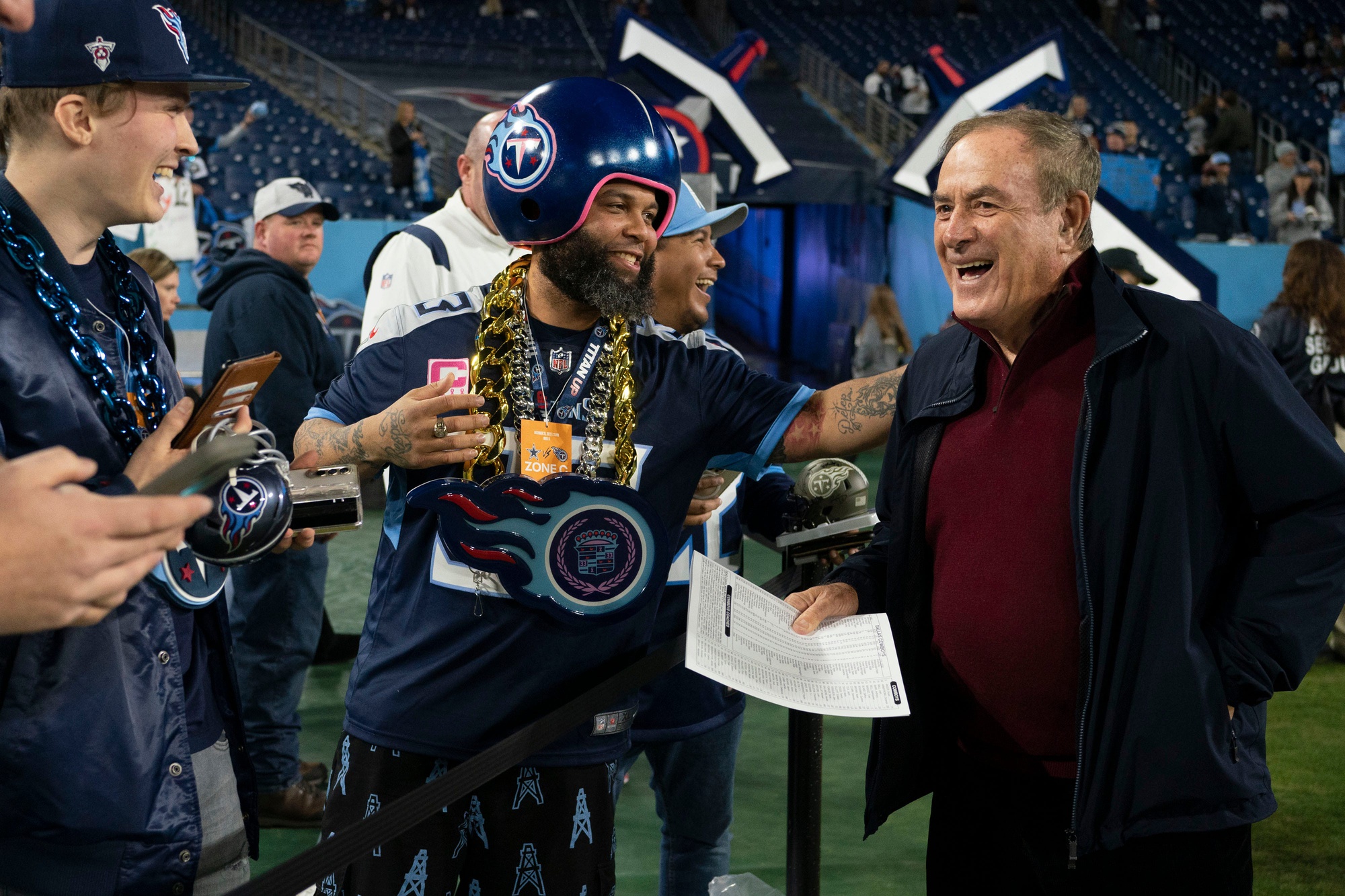 Tennessee Titans fans laugh with NFL commentator Al Michaels before the game between the Tennessee Titans and the Dallas Cowboys at Nissan Stadium Thursday, Dec. 29, 2022, in Nashville, Tenn. © George Walker IV / Tennessean.com / USA TODAY NETWORK