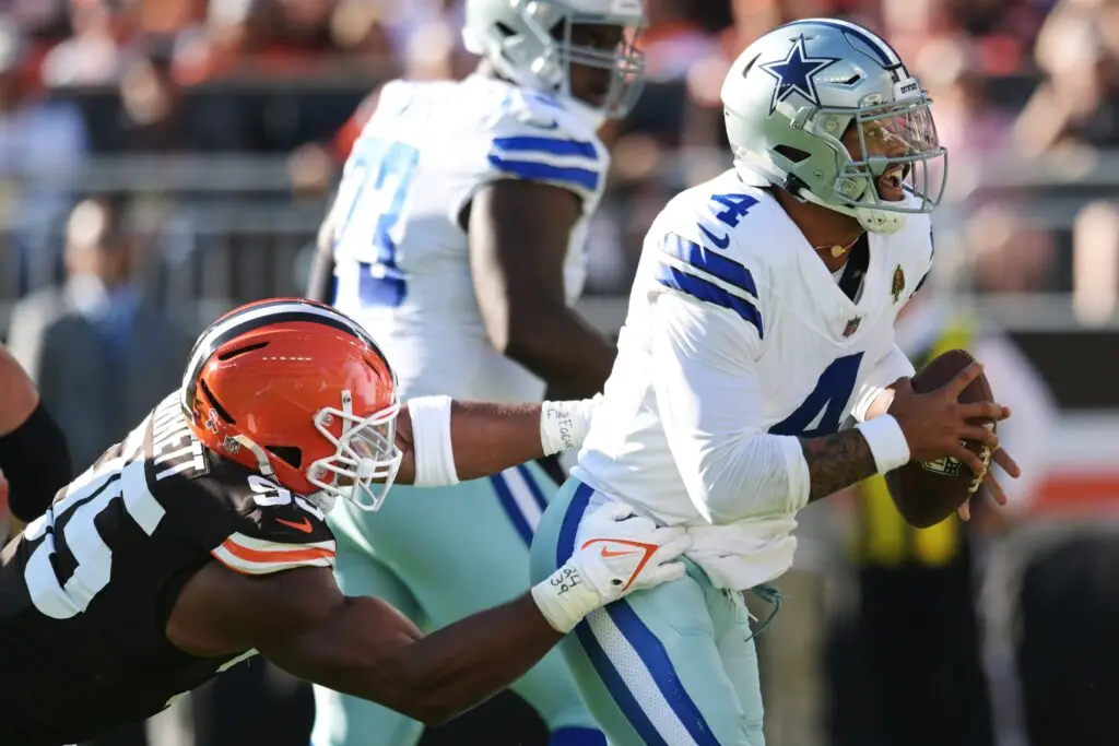 Sep 8, 2024; Cleveland, Ohio, USA; Dallas Cowboys quarterback Dak Prescott (4) is tackled by Cleveland Browns defensive end Myles Garrett (95) during the first half at Huntington Bank Field. Mandatory Credit: Ken Blaze-Imagn Images