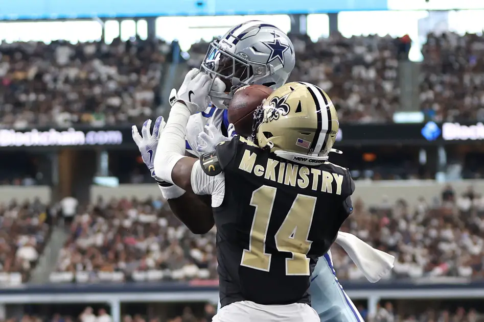 Sep 15, 2024; Arlington, Texas, USA; Dallas Cowboys wide receiver CeeDee Lamb (88) cannot catch a pass while defended by New Orleans Saints cornerback Kool-Aid McKinstry (14) at AT&T Stadium. Mandatory Credit: Tim Heitman-Imagn Images