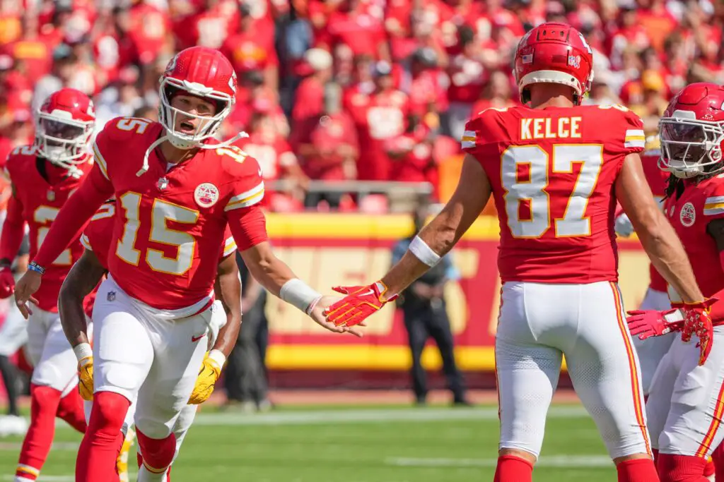 Sep 15, 2024; Kansas City, Missouri, USA; Kansas City Chiefs quarterback Patrick Mahomes (15) greets tight end Travis Kelce (87) during player introductions against the Cincinnati Bengals prior to a game at GEHA Field at Arrowhead Stadium. Mandatory Credit: Denny Medley-Imagn Images