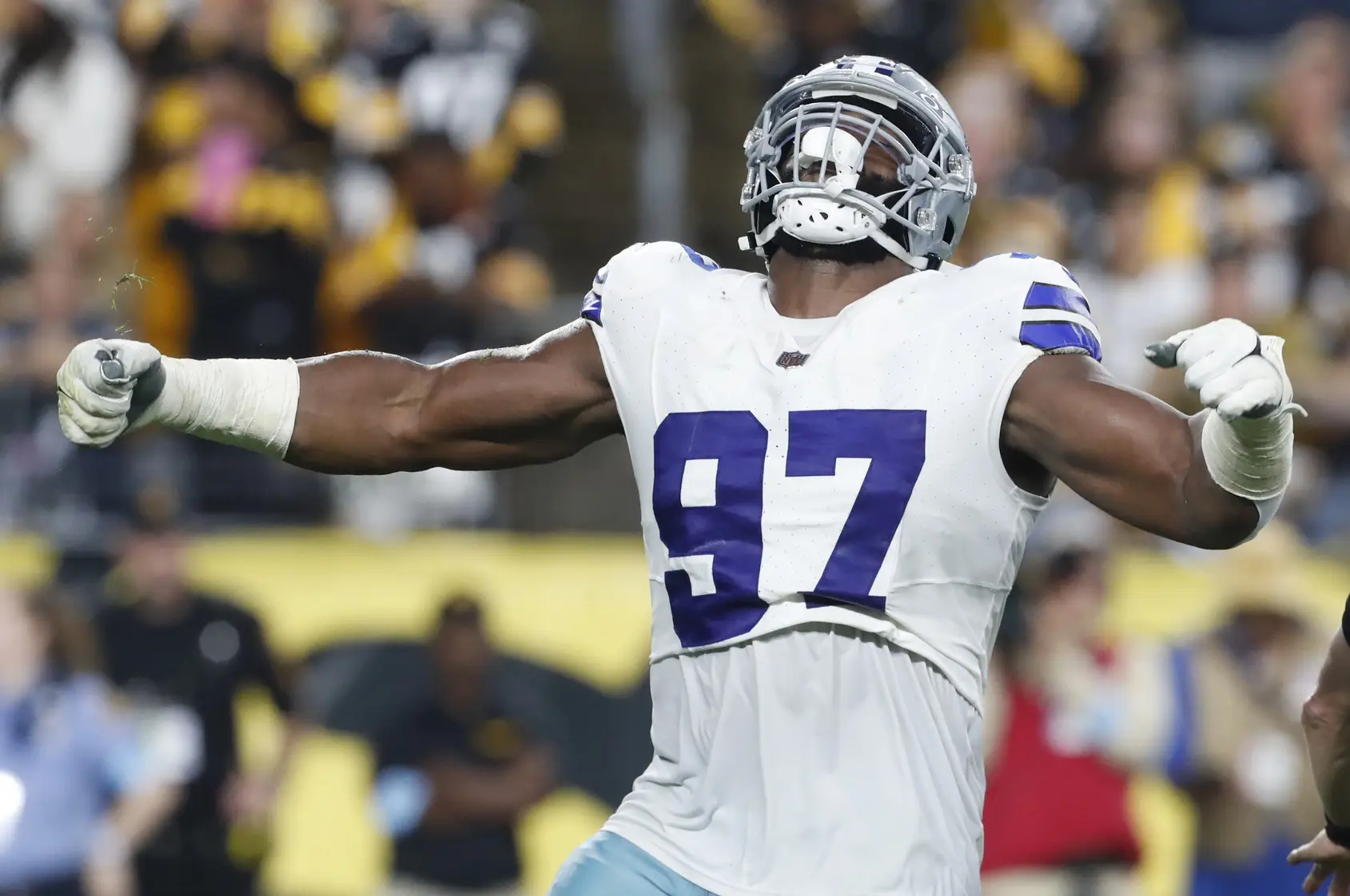 Oct 6, 2024; Pittsburgh, Pennsylvania, USA; Dallas Cowboys defensive tackle Osa Odighizuwa (97) reacts to sacking Pittsburgh Steelers quarterback Justin Fields (not pictured) during the second quarter at Acrisure Stadium. Mandatory Credit: Charles LeClaire-Imagn Images