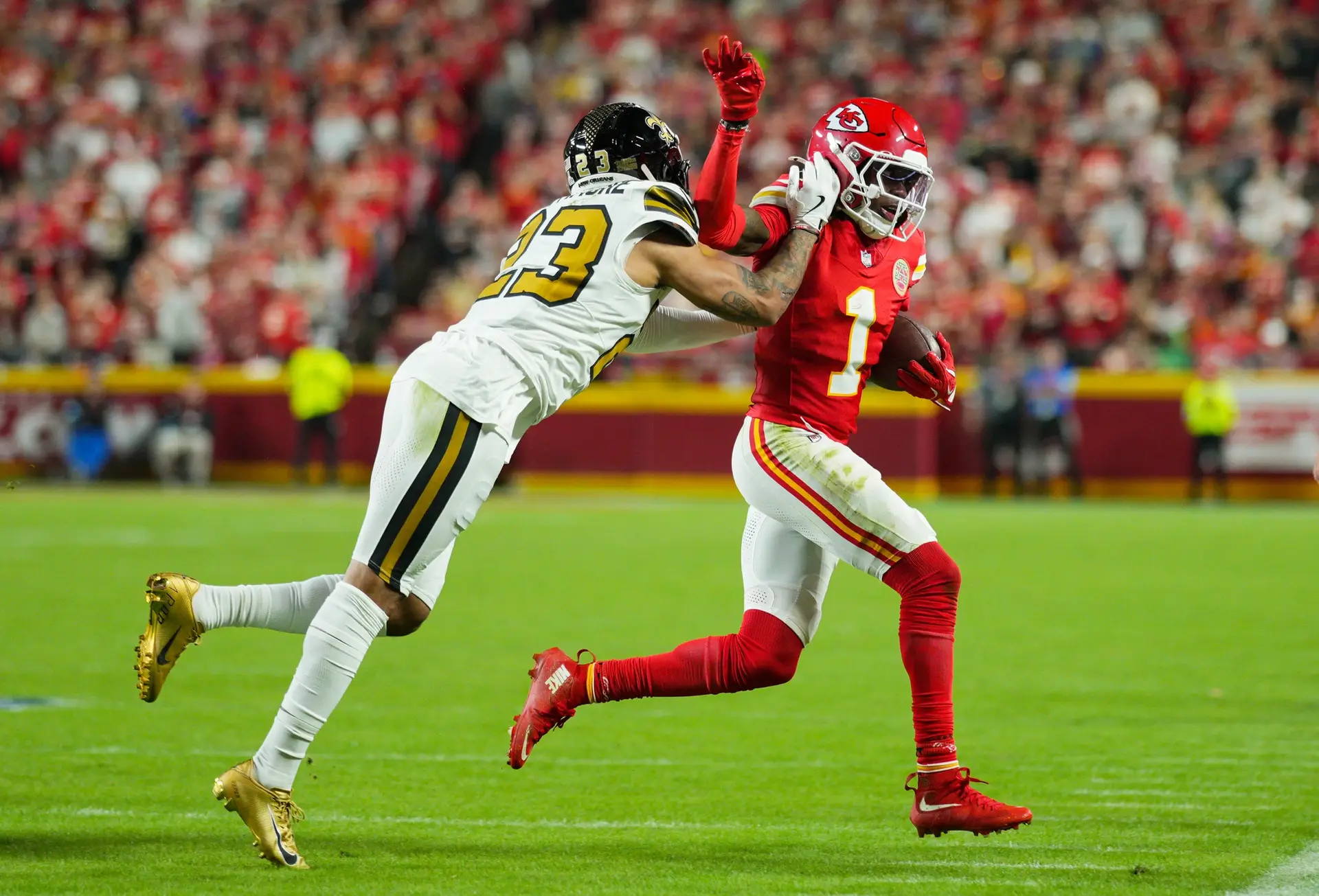 Oct 7, 2024; Kansas City, Missouri, USA; New Orleans Saints cornerback Alontae Taylor (1) runs with the ball against New Orleans Saints cornerback Marshon Lattimore (23) at GEHA Field at Arrowhead Stadium. Mandatory Credit: Jay Biggerstaff-Imagn Images