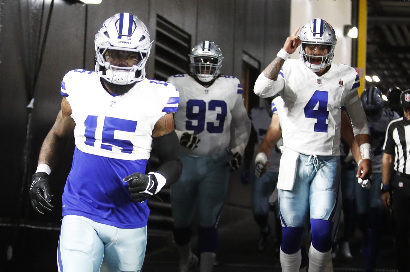 Oct 6, 2024; Pittsburgh, Pennsylvania, USA; Dallas Cowboys running back Ezekiel Elliott (15) and quarterback Dak Prescott (4) take the field to play the Pittsburgh Steelers at Acrisure Stadium. Mandatory Credit: Charles LeClaire-Imagn Images