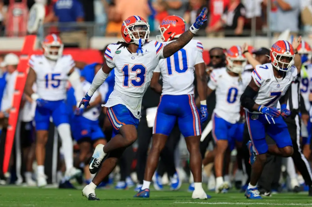 Florida Gators defensive back Aaron Gates (13) celebrates his interception during the second quarter of an NCAA college football matchup Saturday, Nov. 2, 2024 at EverBank Stadium in Jacksonville, Fla. The Georgia Bulldogs defeated the Florida Gators 34-20. [Corey Perrine/Florida Times-Union]