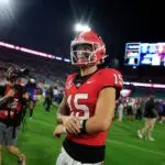“Playing For the Money, Not the Logo” – #3 Georgia Bulldogs Fans Irked By QB Smiling During Brutal Loss