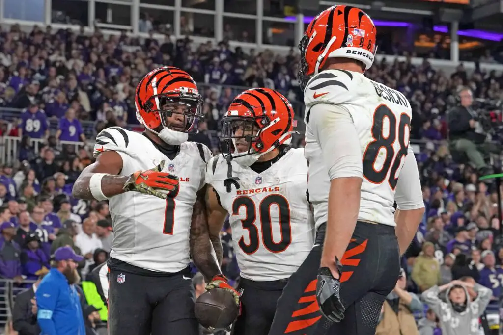 Nov 7, 2024; Baltimore, Maryland, USA; Cincinnati Bengals wide receiver Ja’Marr Chase (1) celebrates with running back Chase Brown (30) and tight end Mike Gesicki (88) following his fourth quarter touchdown catch against the Baltimore Ravens at M&T Bank Stadium. Mandatory Credit: Mitch Stringer-Imagn Images