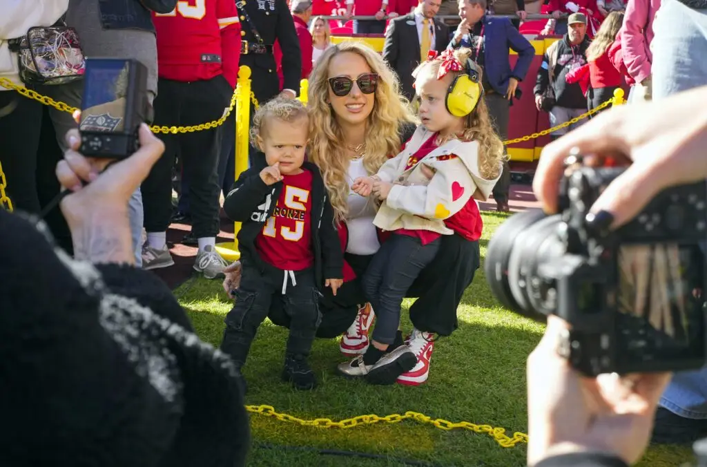 Nov 10, 2024; Kansas City, Missouri, USA; Brittany Mahomes and children watch warmups prior to game between the Kansas City Chiefs and the Denver Broncos at GEHA Field at Arrowhead Stadium. Mandatory Credit: Jay Biggerstaff-Imagn Images