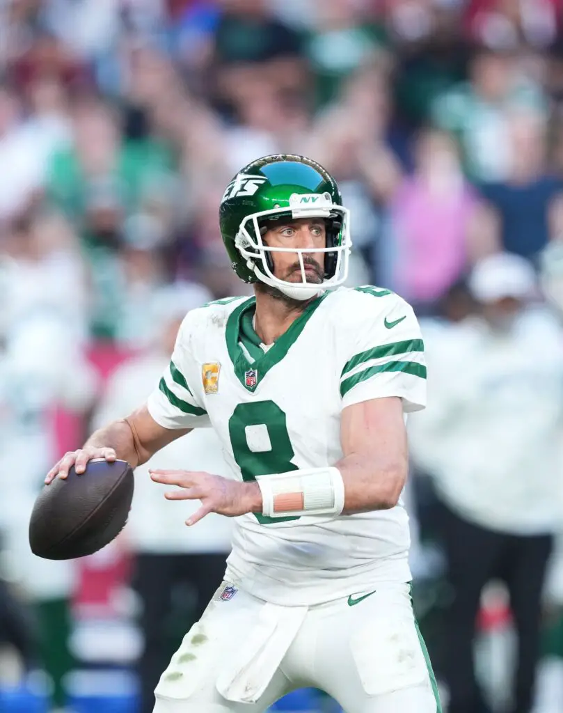 Nov 10, 2024; Glendale, Arizona, USA; New York Jets quarterback Aaron Rodgers (8) passes against the Arizona Cardinals during the second half at State Farm Stadium. Mandatory Credit: Joe Camporeale-Imagn Images