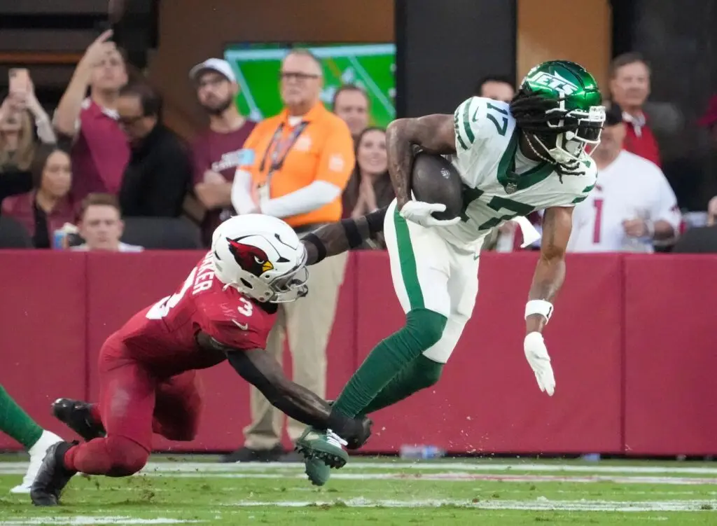 New York Jets wide receiver Davante Adams (17) is tackled by Arizona Cardinals safety Budda Baker (3) during the fourth quarter at State Farm Stadium. © Michael Chow/The Republic / USA TODAY NETWORK via Imagn Images