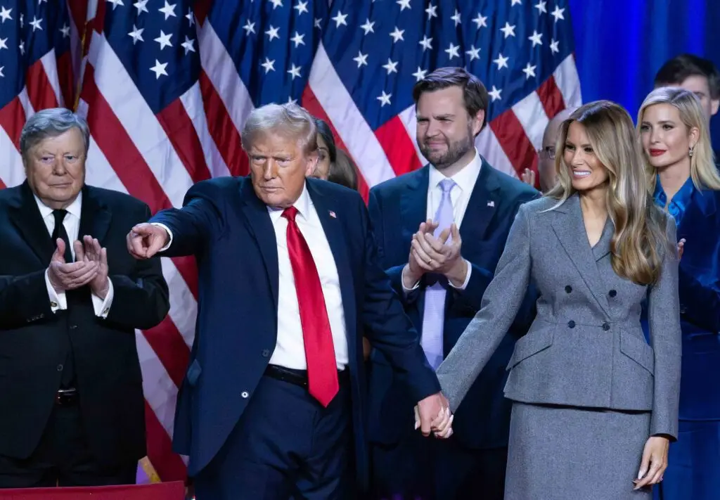 Donald Trump holds hands with wife Melania Trump at his Election Night Watch Party at the Palm Beach County Convention Center after being elected the 47th President of the United States. Viktor Knavs, JD Vance and Ivanka Trump also are in the photo.© Damon Higgins/PALM BEACH DAILY NEWS/USA TODAY NETWORK / USA TODAY NETWORK via Imagn Images (NFL)