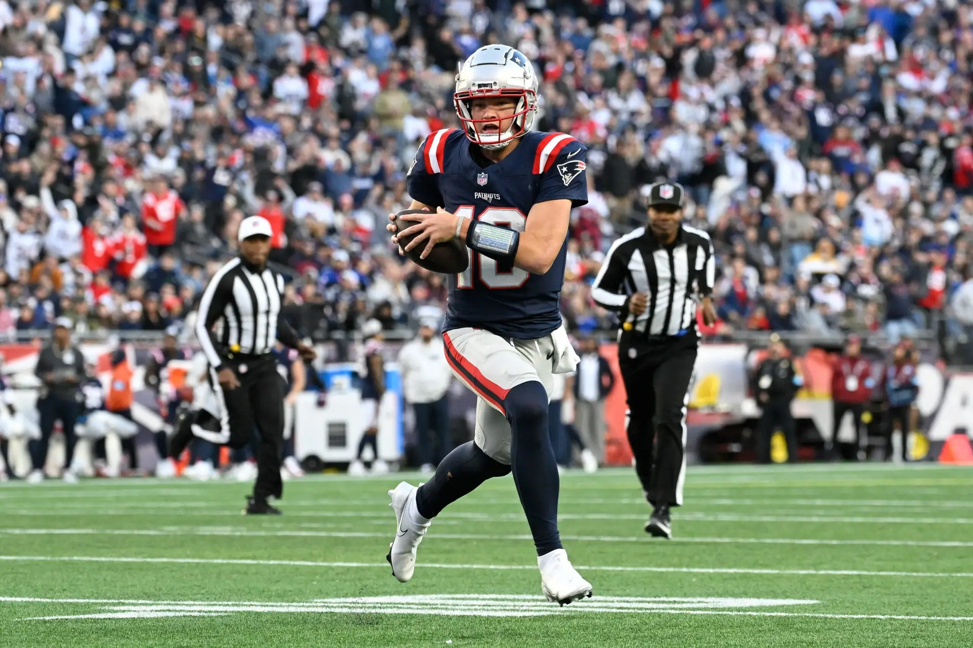 Nov 17, 2024; Foxborough, Massachusetts, USA; New England Patriots quarterback Drake Maye (10) runs the ball against the Los Angeles Rams during the second half at Gillette Stadium. Mandatory Credit: Eric Canha-Imagn Images