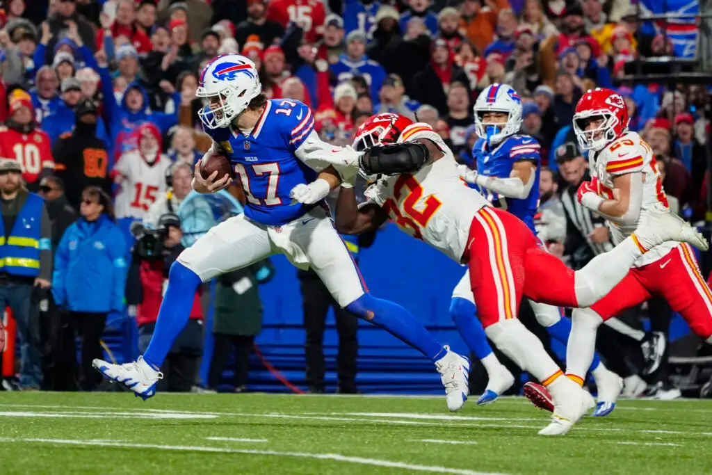 Nov 17, 2024; Orchard Park, New York, USA; Buffalo Bills quarterback Josh Allen (17) runs with the ball for a touchdown against Kansas City Chiefs linebacker Nick Bolton (32) during the second half at Highmark Stadium. Mandatory Credit: Gregory Fisher-Imagn Images