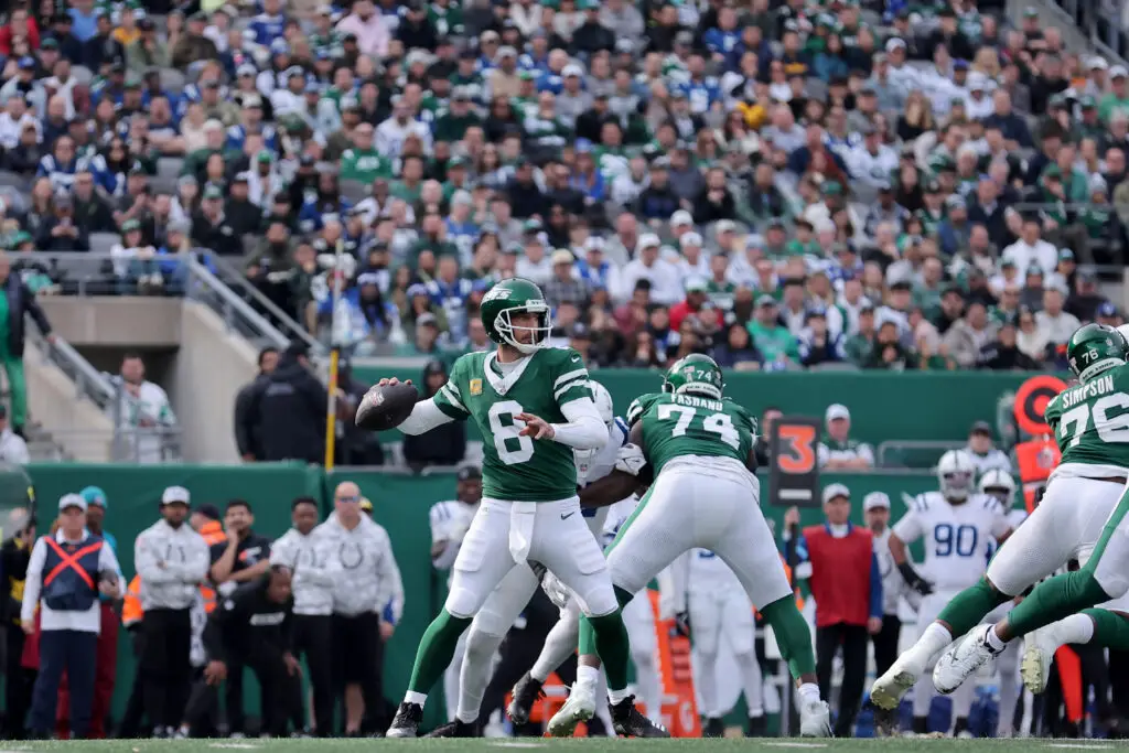 Nov 17, 2024; East Rutherford, New Jersey, USA; New York Jets quarterback Aaron Rodgers (8) drops back to pass against the Indianapolis Colts during the first quarter at MetLife Stadium. Mandatory Credit: Brad Penner-Imagn Images