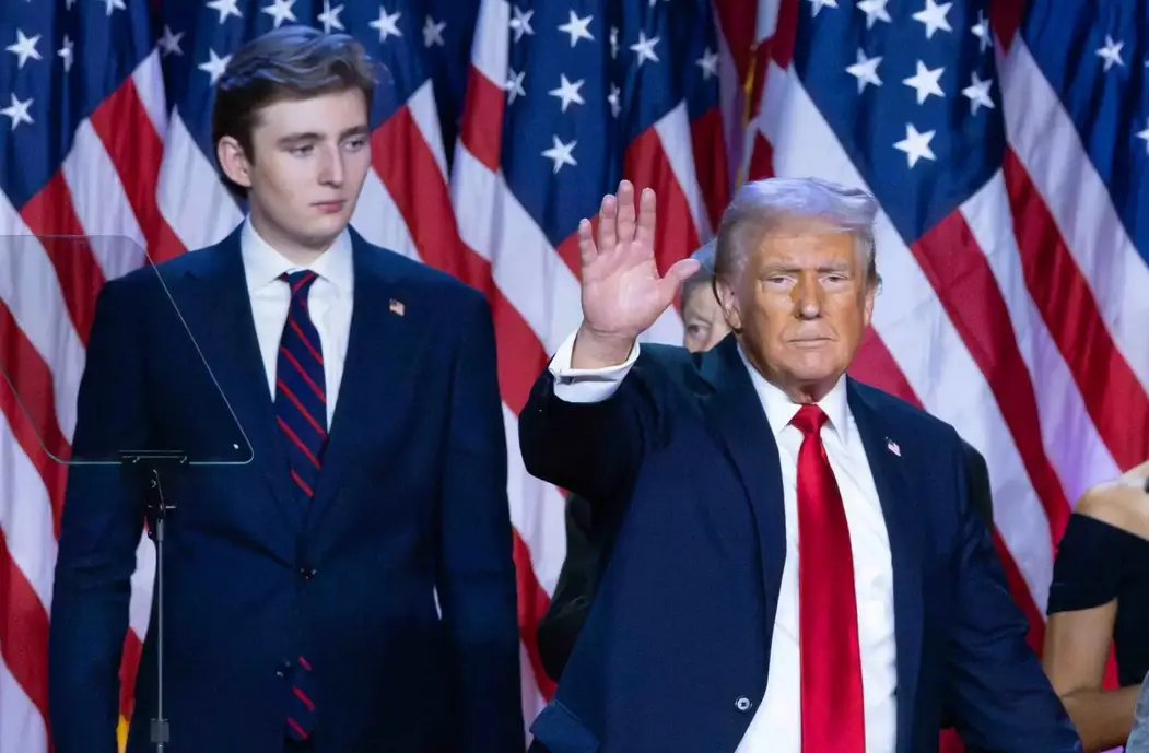 Surrounded by family members like Barron Trump and supporters, Donald Trump makes his acceptance speech at his Election Night Watch Party at the Palm Beach County Convention Center in Florida after being elected the 47th president of the United States on November 5, 2024. © DAMON HIGGINS/PALM BEACH POST/USA TODAY NETWORK / USA TODAY NETWORK via Imagn Images