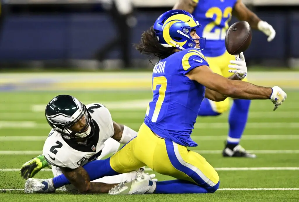 Nov 24, 2024; Inglewood, California, USA; Los Angeles Rams wide receiver Puka Nacua (17) juggles a pass dropped, defended by Philadelphia Eagles cornerback Darius Slay Jr. (2) during the first half at SoFi Stadium. Mandatory Credit: Alex Gallardo-Imagn Images