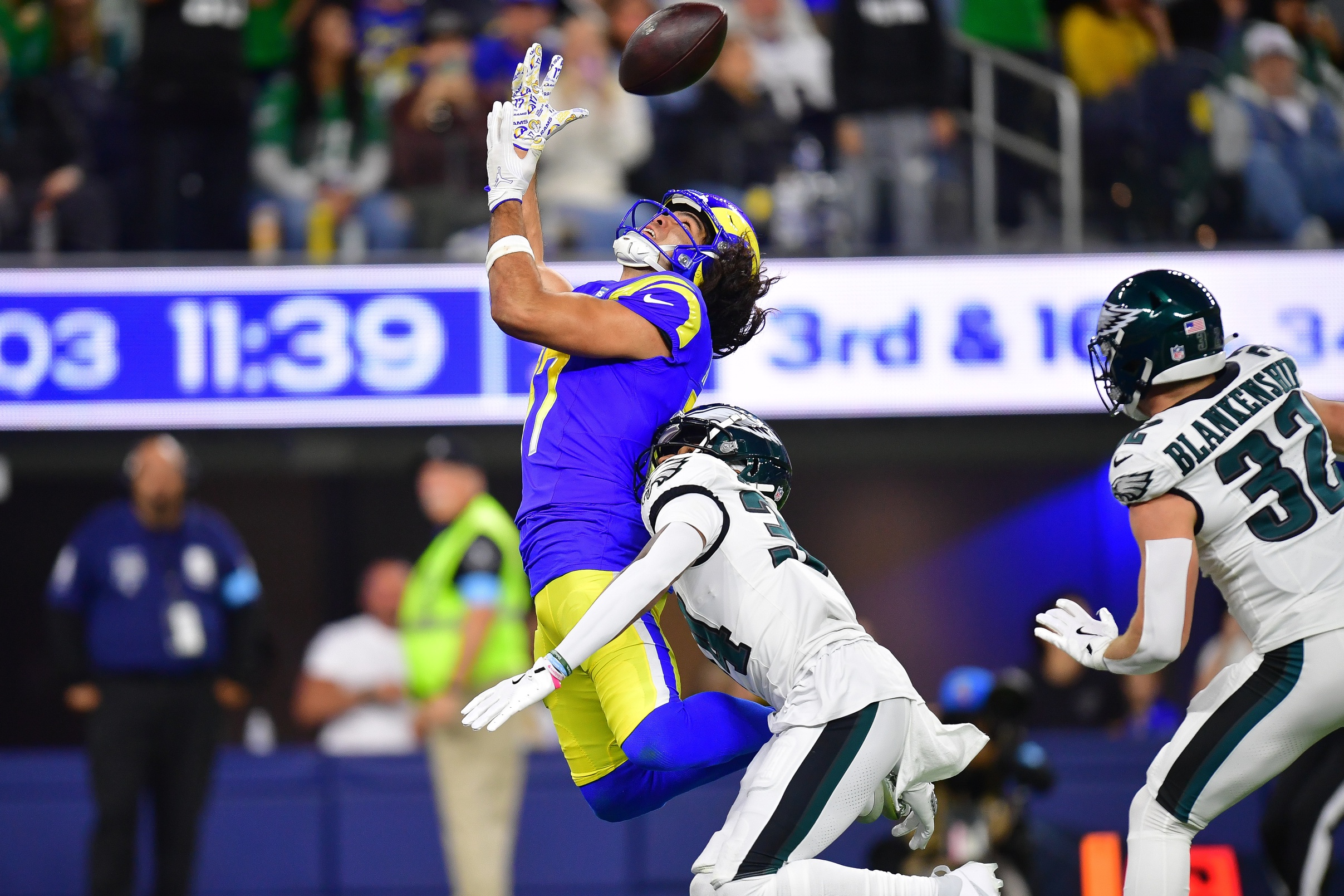 Nov 24, 2024; Inglewood, California, USA; Philadelphia Eagles cornerback Isaiah Rodgers (34) defends against Los Angeles Rams wide receiver Puka Nacua (17) during the second half at SoFi Stadium. Mandatory Credit: Gary A. Vasquez-Imagn Images