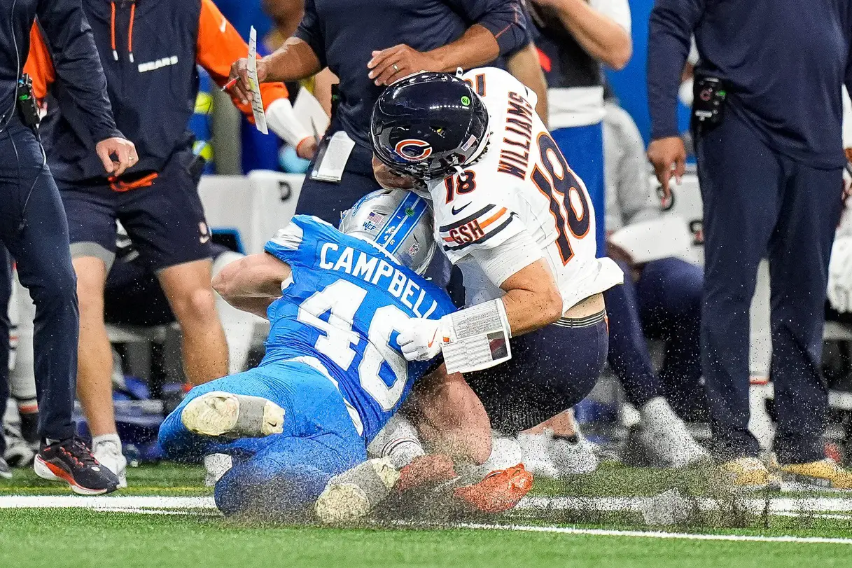 Detroit Lions linebacker Jack Campbell (46) tackles Chicago Bears quarterback Caleb Williams (18) during the second half at Ford Field in Detroit on Thursday, Nov. 28, 2024. © Junfu Han / USA TODAY NETWORK via Imagn Images