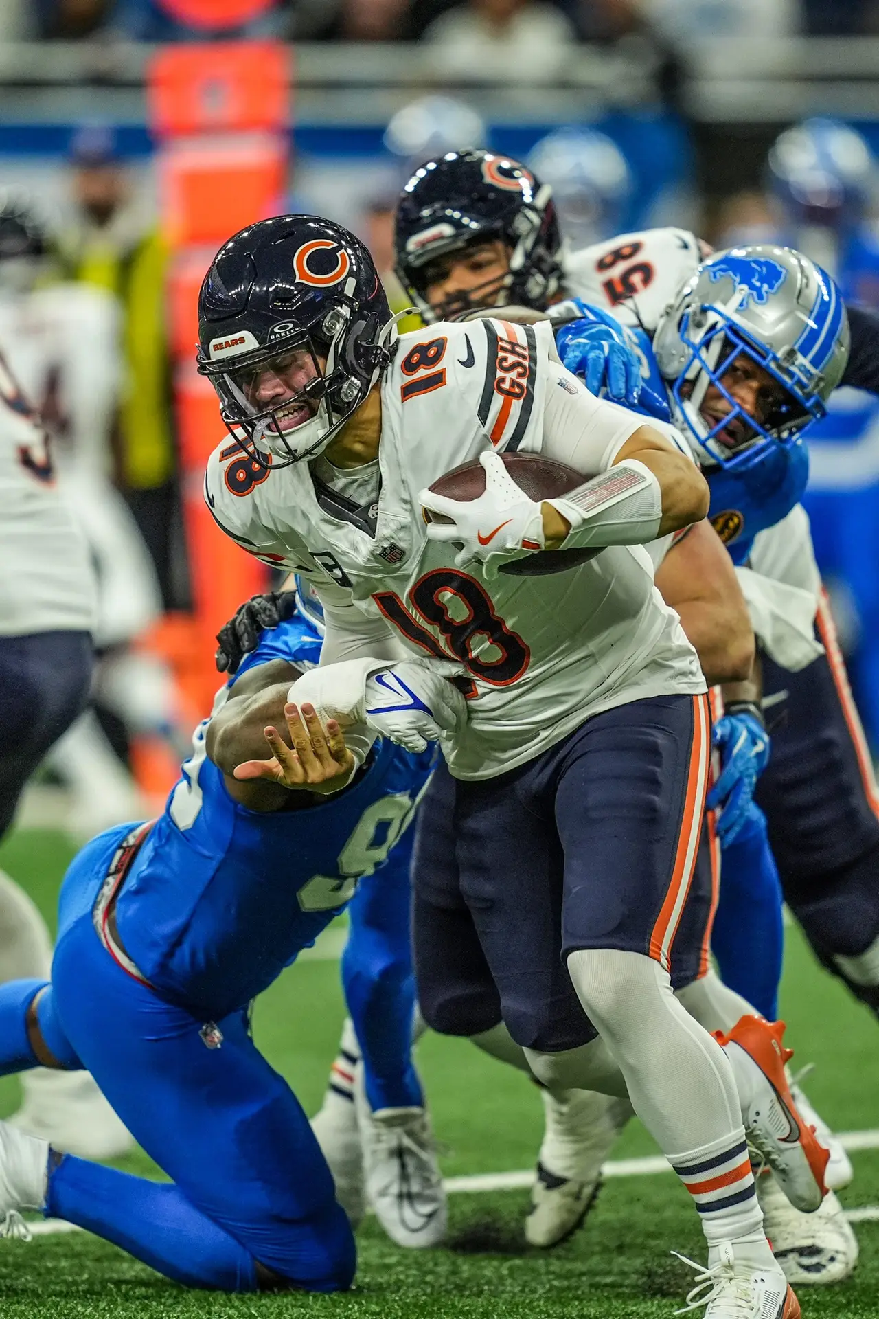 Chicago Bears quarterback Caleb Williams (18) is pressured by Detroit Lions defensive end Za'Darius Smith (99) on Thanksgiving Day at Ford Field in Detroit on Thursday, Nov. 28, 2024. © Kimberly P. Mitchell / USA TODAY NETWORK via Imagn Images