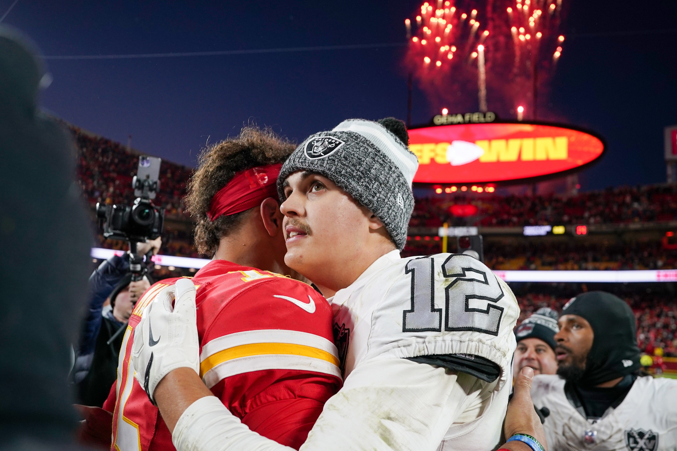 Nov 29, 2024; Kansas City, Missouri, USA; Kansas City Chiefs quarterback Patrick Mahomes (15) greets Las Vegas Raiders quarterback Aidan O'Connell (12) after the game at GEHA Field at Arrowhead Stadium. Mandatory Credit: Denny Medley-Imagn Images