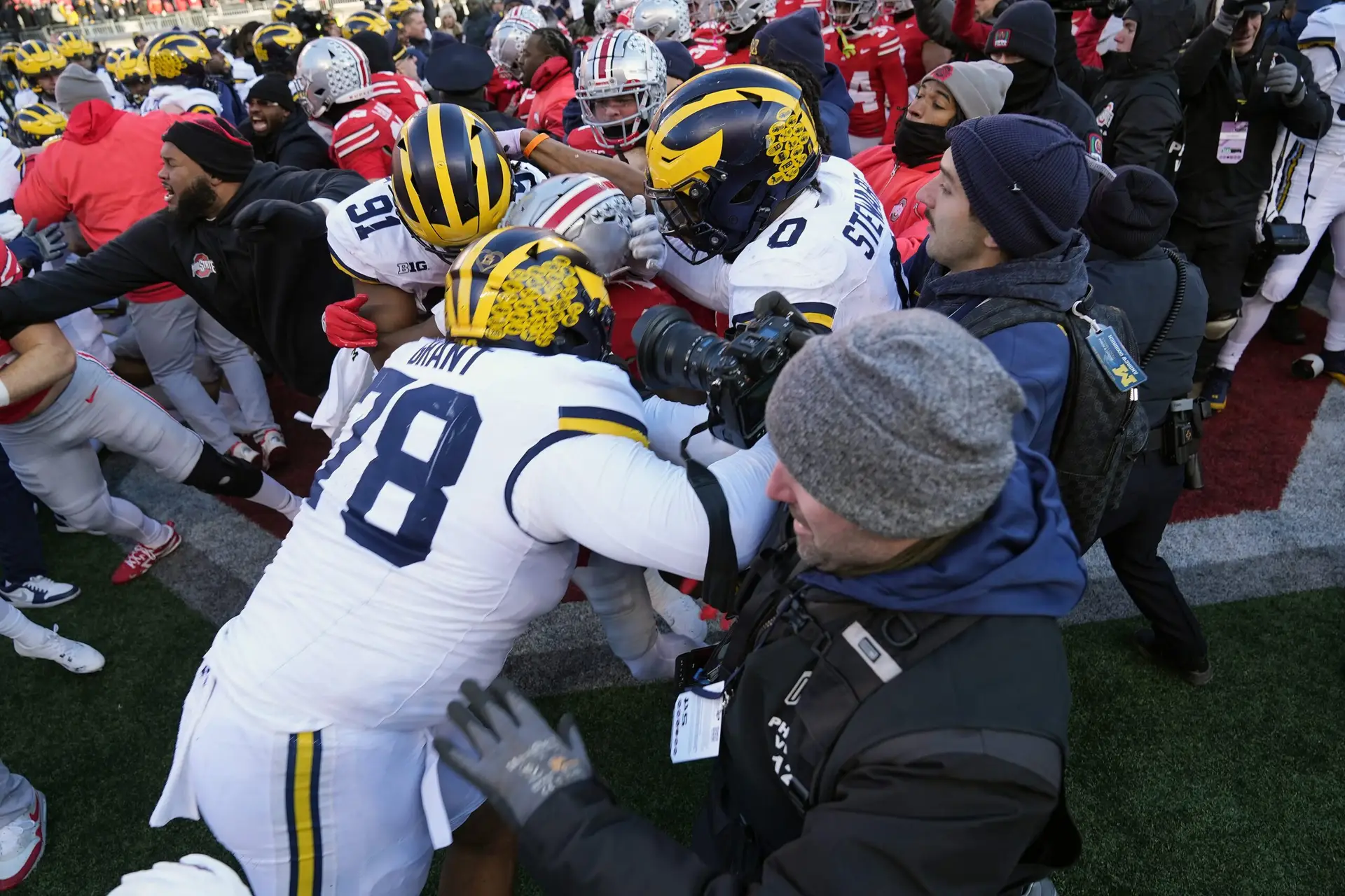 Michigan Wolverines defensive lineman Kenneth Grant (78) goes after Ohio State Buckeyes safety Jaylen McClain (18) after the game during a fight at the middle of the field after the NCAA football game at Ohio Stadium in Columbus on Saturday, Nov. 30, 2024. © Kyle Robertson/Columbus Dispatch / USA TODAY NETWORK via Imagn Images