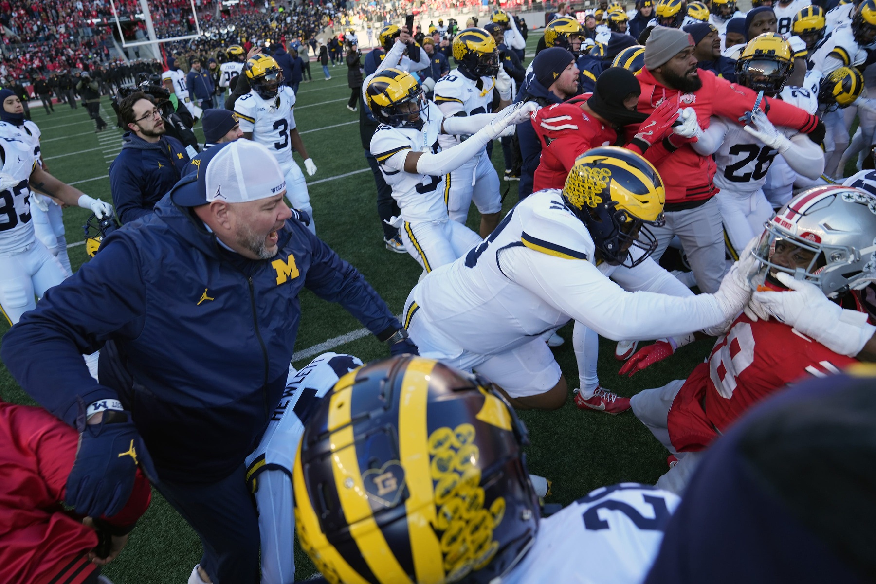 Michigan Wolverines defensive lineman Kenneth Grant (78) goes after Ohio State Buckeyes safety Jaylen McClain (18) after the game during a fight at the middle of the field after the NCAA football game at Ohio Stadium in Columbus on Saturday, Nov. 30, 2024. © Kyle Robertson/Columbus Dispatch / USA TODAY NETWORK via Imagn Images