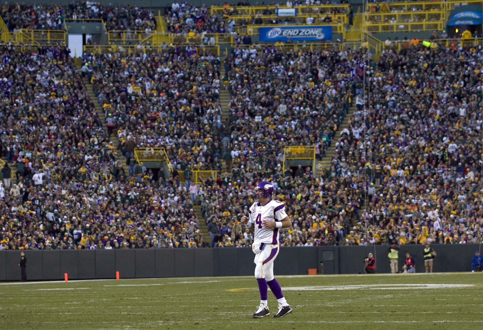 Nov 1, 2009; Green Bay, WI, USA; Minnesota Vikings quarterback Brett Favre (4) jogs onto the field during the game against the Green Bay Packers at Lambeau Field.  The Vikings defeated the Packers 38-26.  Mandatory Credit: Jeff Hanisch-USA TODAY Sports