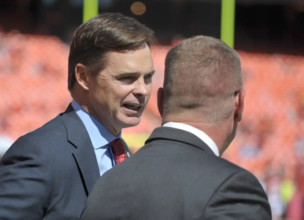 Kansas City Chiefs president Mark Donovan (left) speaks with general manager John Dorsey