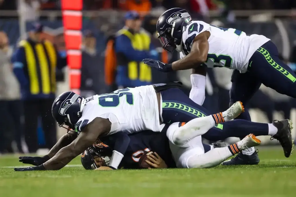 Seahawks defensive tackle Jarran Reed (90) sacks Bears quarterback Caleb Williams to make it fourth-and-20 during the third quarter on Dec. 26, 2024, at Soldier Field. (Armando L. Sanchez/Chicago Tribune)