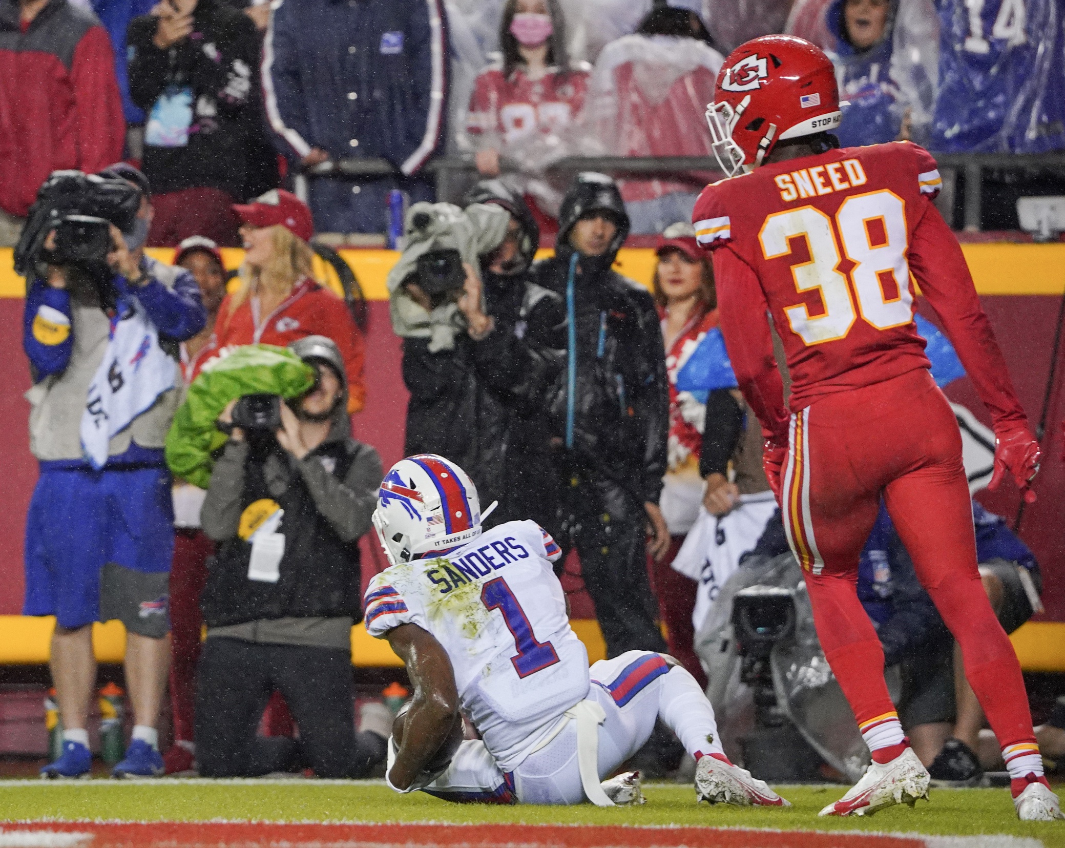 Oct 10, 2021; Kansas City, Missouri, USA; Buffalo Bills wide receiver Emmanuel Sanders (1) scores a touchdown as Kansas City Chiefs cornerback L'Jarius Sneed (38) looks on during the second half at GEHA Field at Arrowhead Stadium. Mandatory Credit: Denny Medley-Imagn Images