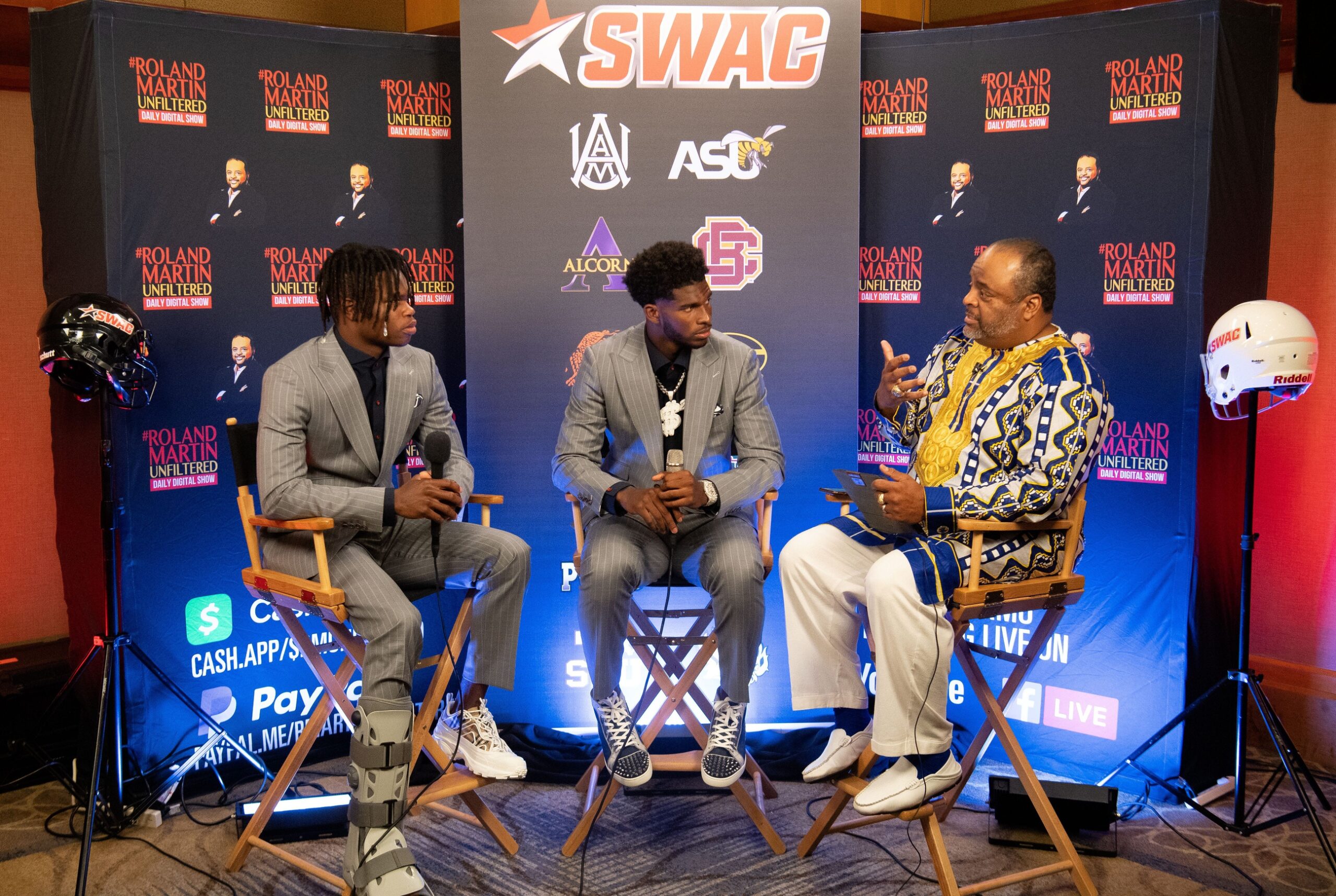 July 21, 2022; Birmingham, AL, USA; Defensive back and wide receiver Travis Hunter and quarterback Shedeur Sanders talk to Roland Martin during the Southwestern Athletic Conference Media Day at the Sheraton Birmingham. Gary Cosby Jr.-The Tuscaloosa News Swac Media Day Buffaloes