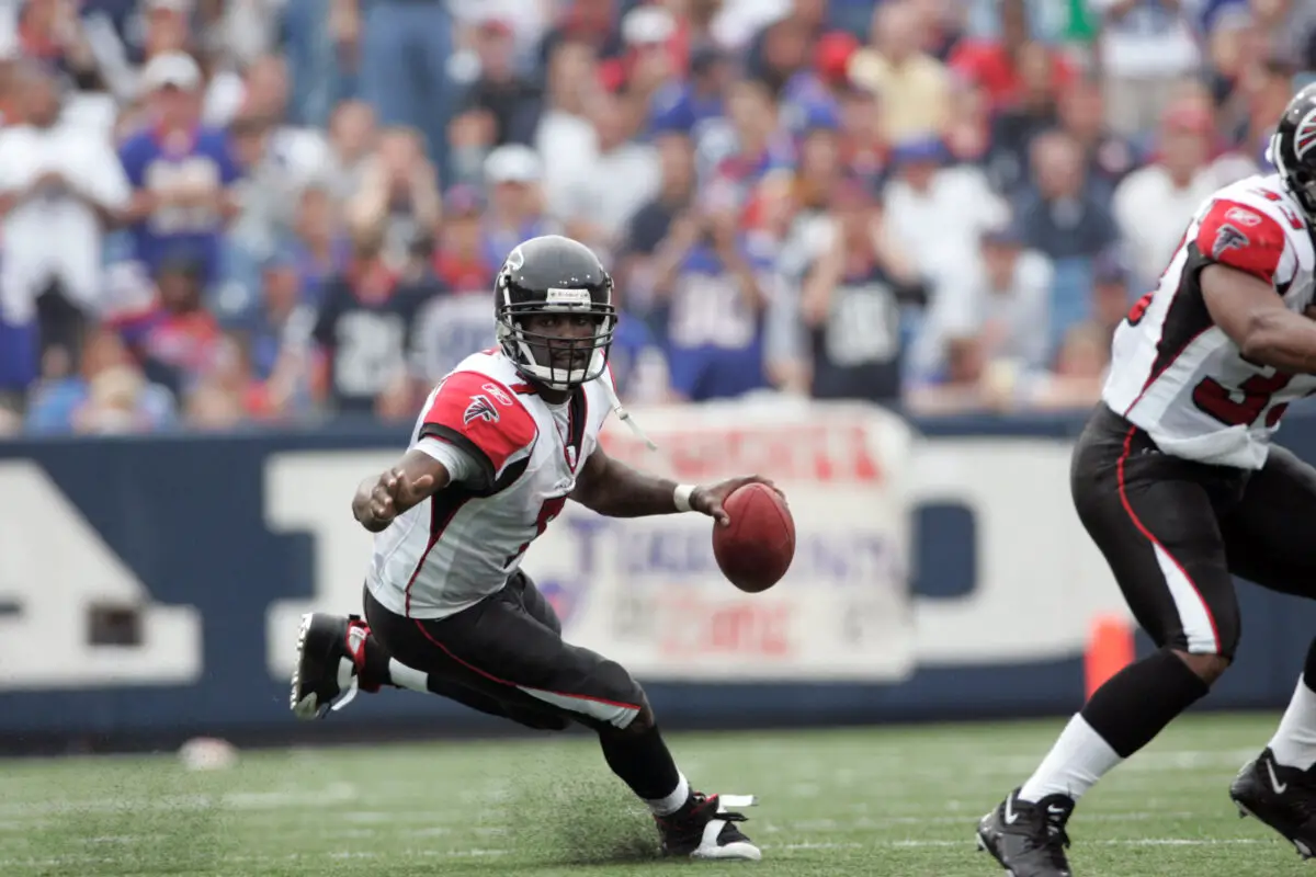 Sep 25, 2005; Orchard Park, NY, USA; Atlanta Falcons quarterback Michael Vick makes a cut against the Buffalo Bills during the fourth quarter at Ralph Wilson Stadium. Vick rushed for 64 yards and the Falcons won 24-16. Mandatory Credit: Photo by Craig Melvin/Imagn Images (c) 2005 by Craig Melvin