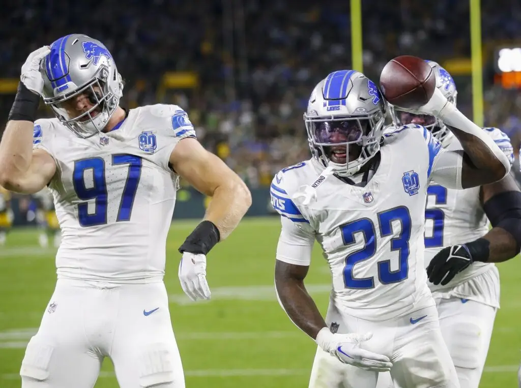 Sep 28, 2023; Green Bay, Wisconsin, USA; Detroit Lions cornerback Jerry Jacobs (23) celebrates with defensive end Aidan Hutchinson (97) after intercepting a pass against the Green Bay Packers during their football game on Thursday, September 28, 2023, at Lambeau Field in Green Bay, Wis. The Lions won the game, 34-20. Mandatory Credit: Tork Mason-Imagn Images