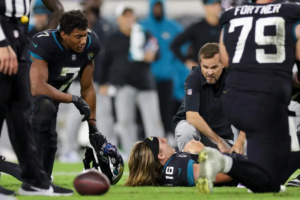 Dec 4, 2023; Jacksonville, Florida, USA; Jacksonville Jaguars quarterback Trevor Lawrence (16) reacts after an injury in the fourth quarter at EverBank Stadium. Mandatory Credit: Nathan Ray Seebeck-USA TODAY Sports