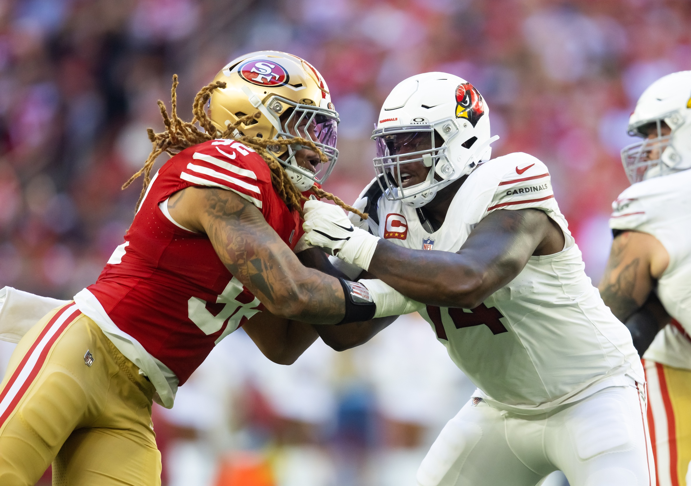 Dec 17, 2023; Glendale, Arizona, USA; San Francisco 49ers defensive end Chase Young (92) against Arizona Cardinals offensive lineman D.J. Humphries (74) at State Farm Stadium. Mandatory Credit: Mark J. Rebilas-Imagn Images