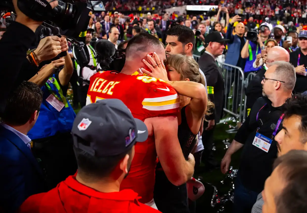 Feb 11, 2024; Paradise, Nevada, USA; Kansas City Chiefs tight end Travis Kelce (87) kisses girlfriend Taylor Swift as they celebrate after defeating the San Francisco 49ers in Super Bowl LVIII at Allegiant Stadium. Mandatory Credit: Mark J. Rebilas-Imagn Images