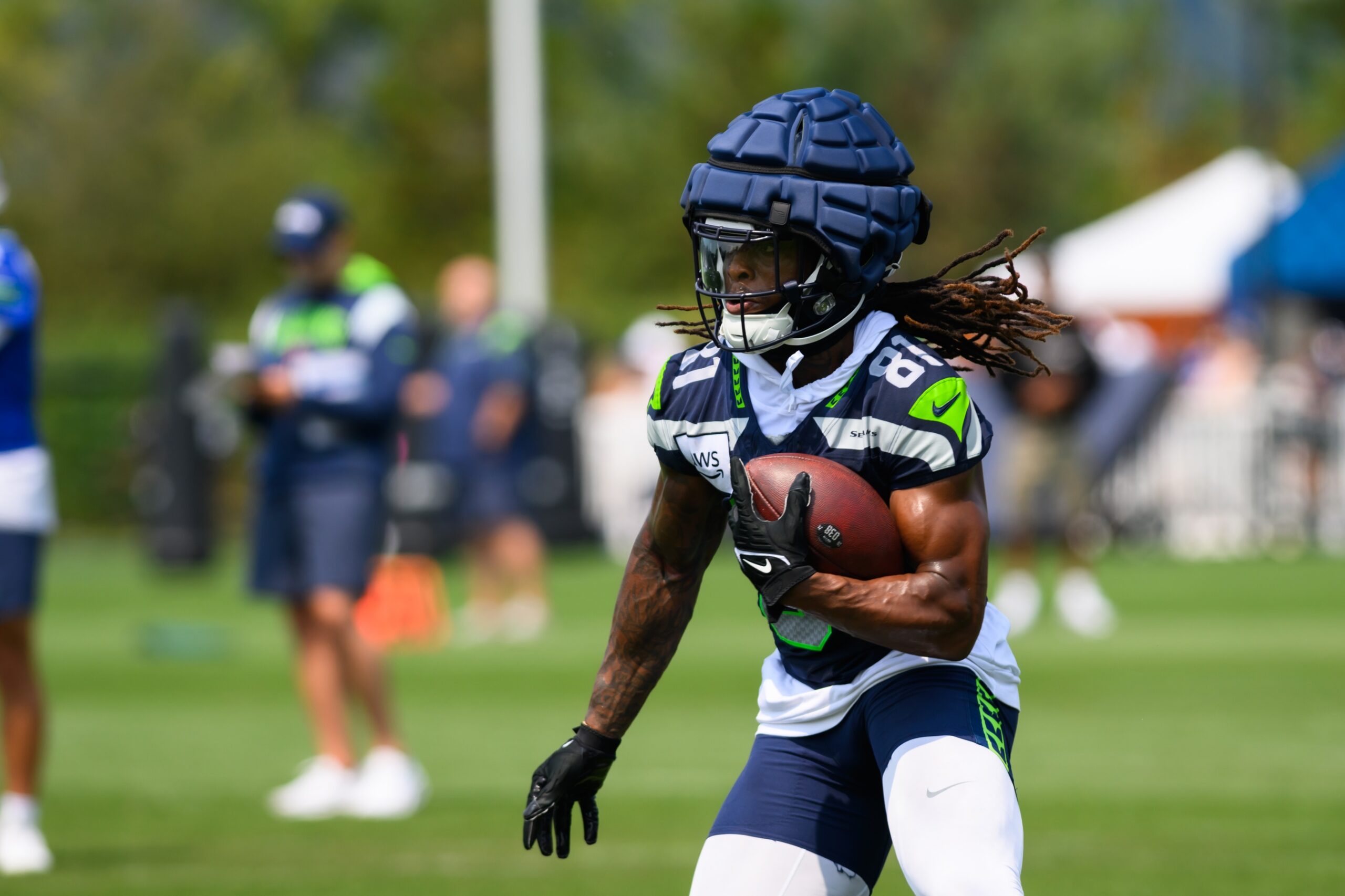 Jul 27, 2024; Renton, WA, USA; Seattle Seahawks wide receiver Laviska Shenault Jr. (81) carries the ball after making a catch during training camp at Virginia Mason Athletic Center. Mandatory Credit: Steven Bisig-Imagn Images