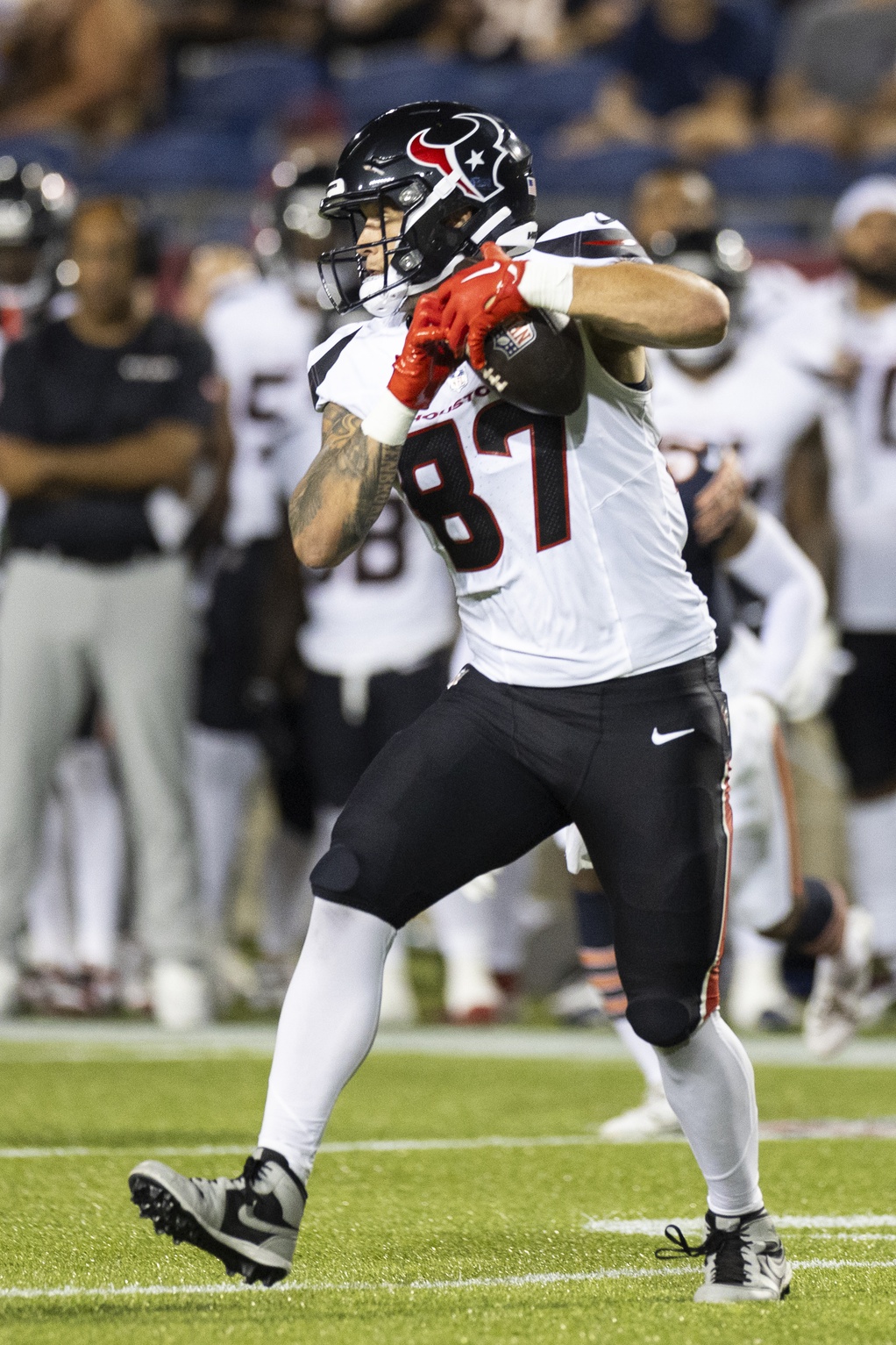 Aug 1, 2024; Canton, Ohio, USA; Houston Texans tight end Cade Stover (87) catches and runs the ball during the third quarter against the Chicago Bears at Tom Benson Hall of Fame Stadium. Mandatory Credit: Scott Galvin-Imagn Images