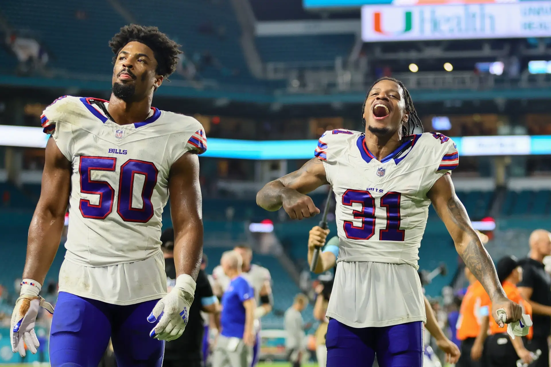 Sep 12, 2024; Miami Gardens, Florida, USA; Buffalo Bills cornerback Rasul Douglas (31) and defensive end Greg Rousseau (50) walk off the field after the game against the Miami Dolphins at Hard Rock Stadium. Mandatory Credit: Sam Navarro-Imagn Images