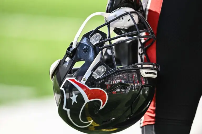 Sep 22, 2024; Minneapolis, Minnesota, USA; A Houston Texans player holds onto his helmet from the sideline during the game against the Minnesota Vikings at U.S. Bank Stadium. Mandatory Credit: Jeffrey Becker-Imagn Images