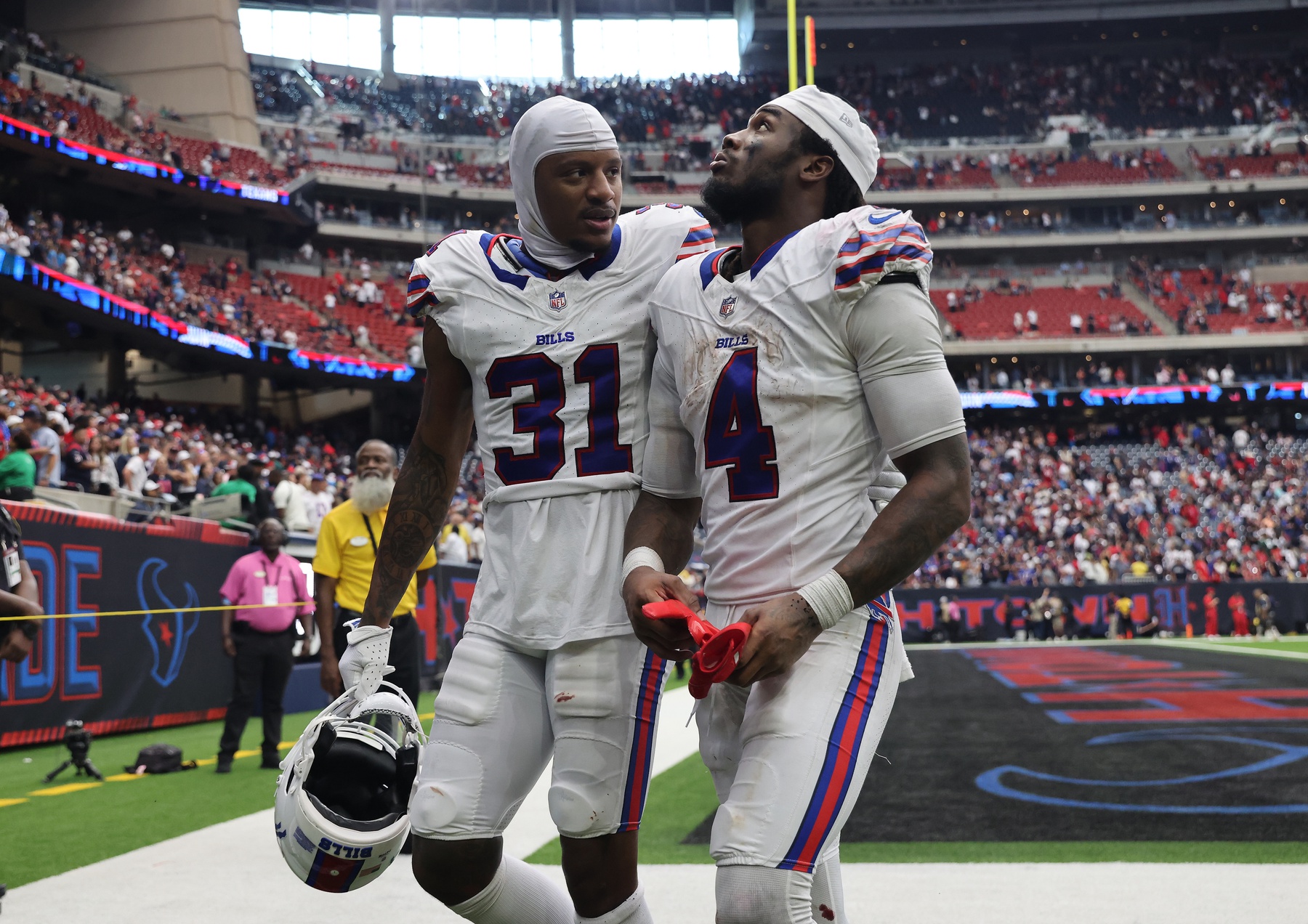 Oct 6, 2024; Houston, Texas, USA; Buffalo Bills cornerback Rasul Douglas (31) and running back James Cook (4) walk to the tunnel after loosing to the Houston Texans at NRG Stadium. Mandatory Credit: Thomas Shea-Imagn Images