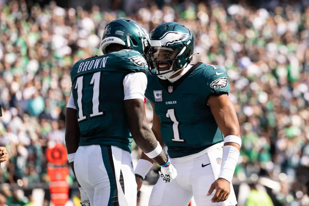 Oct 13, 2024; Philadelphia, Pennsylvania, USA; Philadelphia Eagles quarterback Jalen Hurts (1) and wide receiver A.J. Brown (11) celebrate their touchdown pass during the second quarter against the Cleveland Browns at Lincoln Financial Field. Mandatory Credit: Bill Streicher-Imagn Images