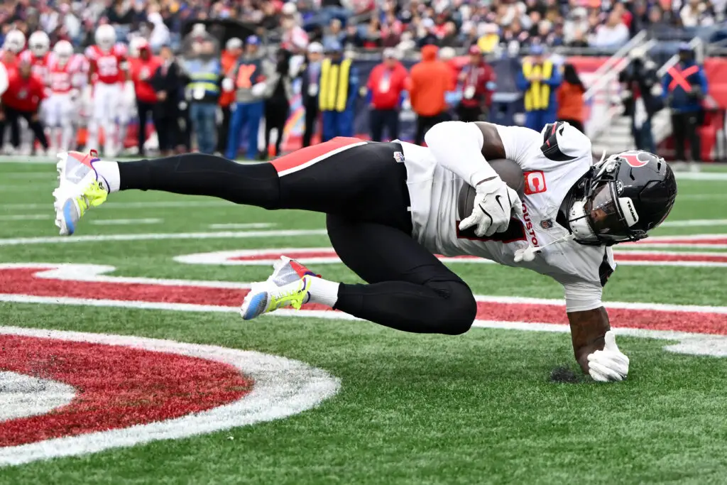 Oct 13, 2024; Foxborough, Massachusetts, USA; Houston Texans wide receiver Stefon Diggs (1) makes a catch for a touchdown against the New England Patriots during the second half at Gillette Stadium. Mandatory Credit: Brian Fluharty-Imagn Images