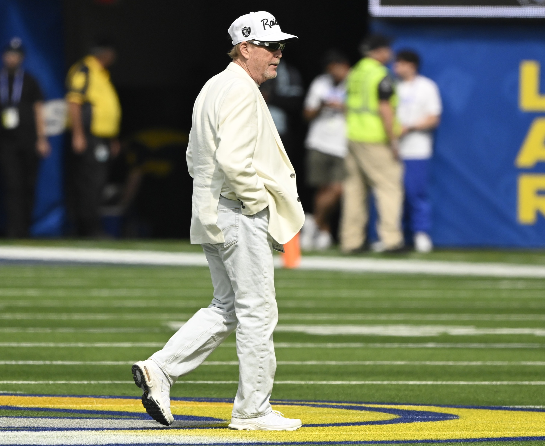 Oct 20, 2024; Inglewood, California, USA; Las Vegas Raiders owner Mark Davis walls across the SoFi Stadium field during pregame warmups before an NFL game against the Los Angeles Rams. Mandatory Credit: Robert Hanashiro-Imagn Images