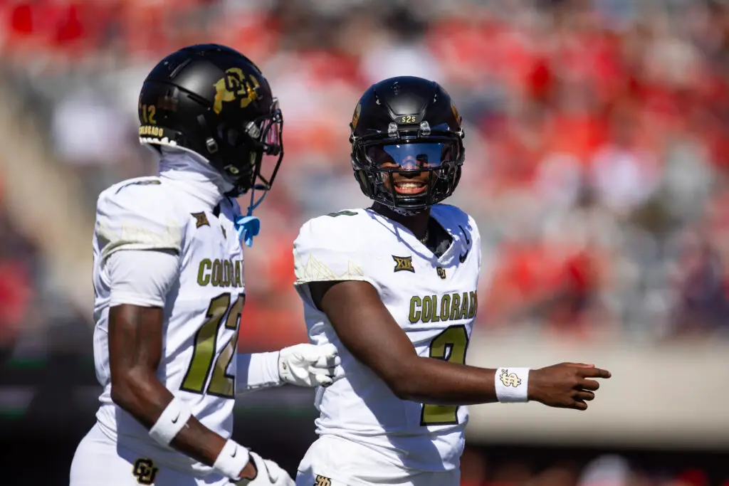 Oct 19, 2024; Tucson, Arizona, USA; Colorado Buffalos quarterback Shedeur Sanders (2) with wide receiver Travis Hunter (12) against the Arizona Wildcats at Arizona Stadium. Mandatory Credit: Mark J. Rebilas-Imagn Images