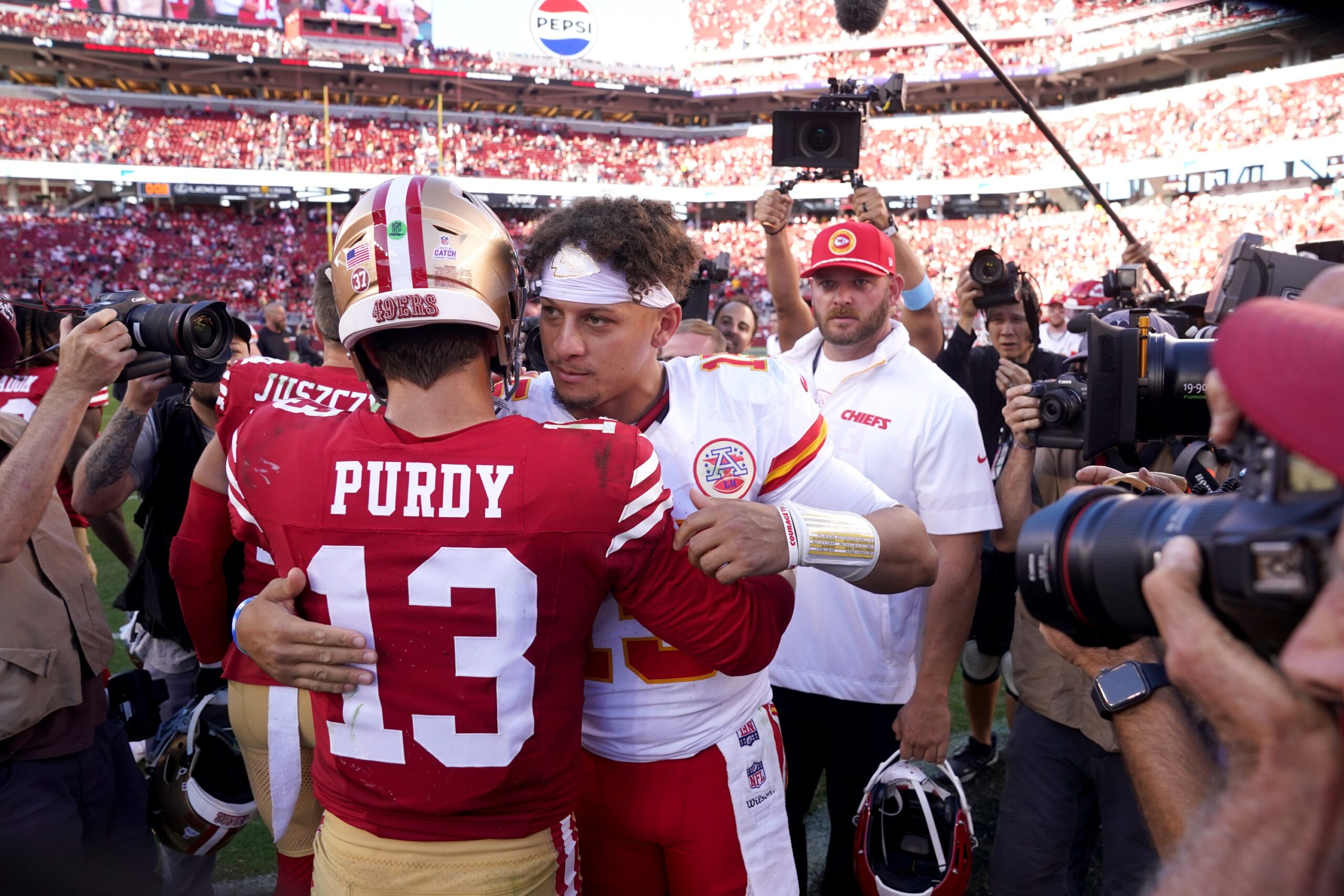 Oct 20, 2024; Santa Clara, California, USA; Kansas City Chiefs quarterback Patrick Mahomes (15) meets with San Francisco 49ers quarterback Brock Purdy (13) after the game at Levi's Stadium. Mandatory Credit: Cary Edmondson-Imagn Images