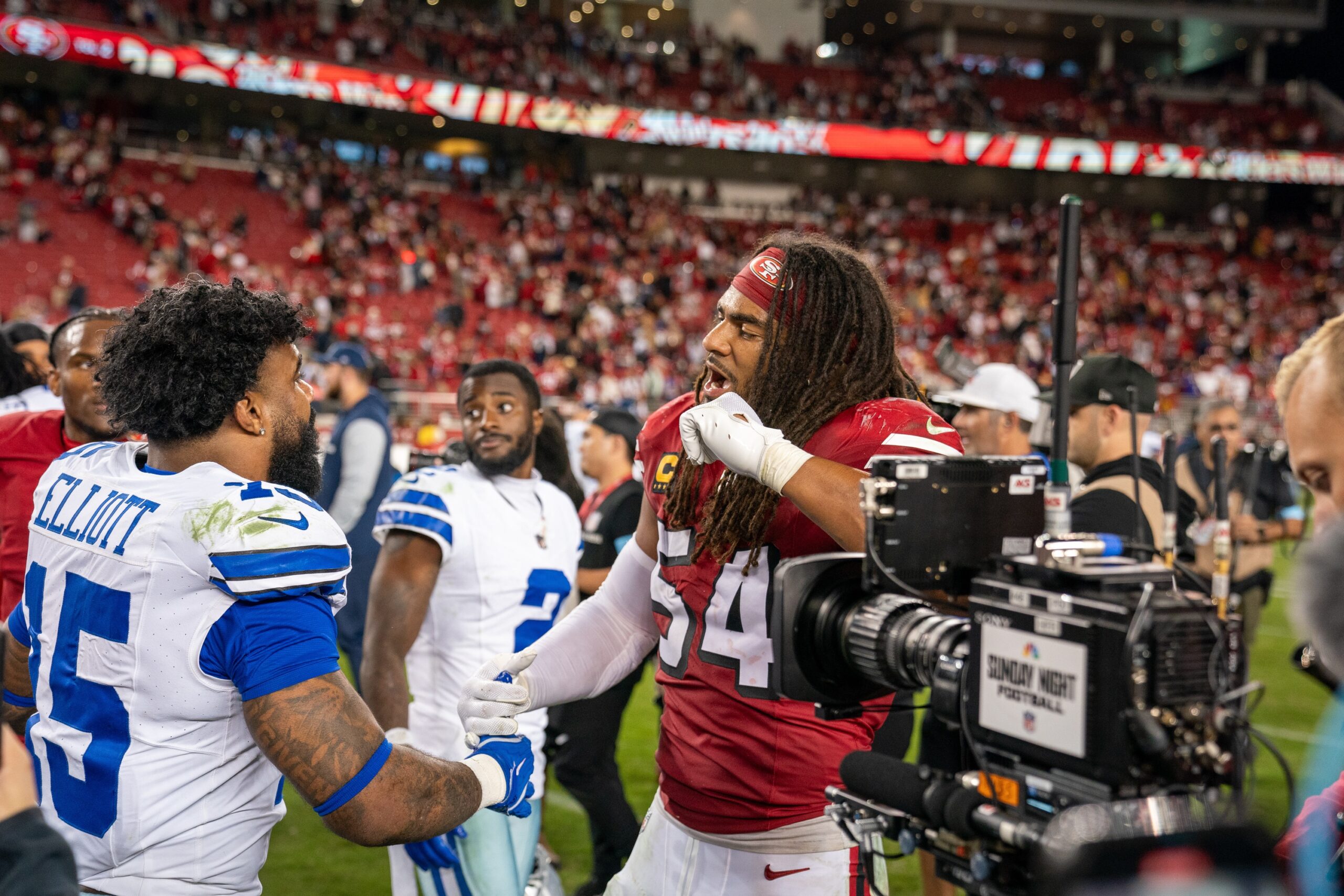 Oct 27, 2024; Santa Clara, California, USA; after the game San Francisco 49ers linebacker Fred Warner (54) and Dallas Cowboys running back Ezekiel Elliott (15) shake hands at Levi's Stadium. Mandatory Credit: Neville E. Guard-Imagn Images