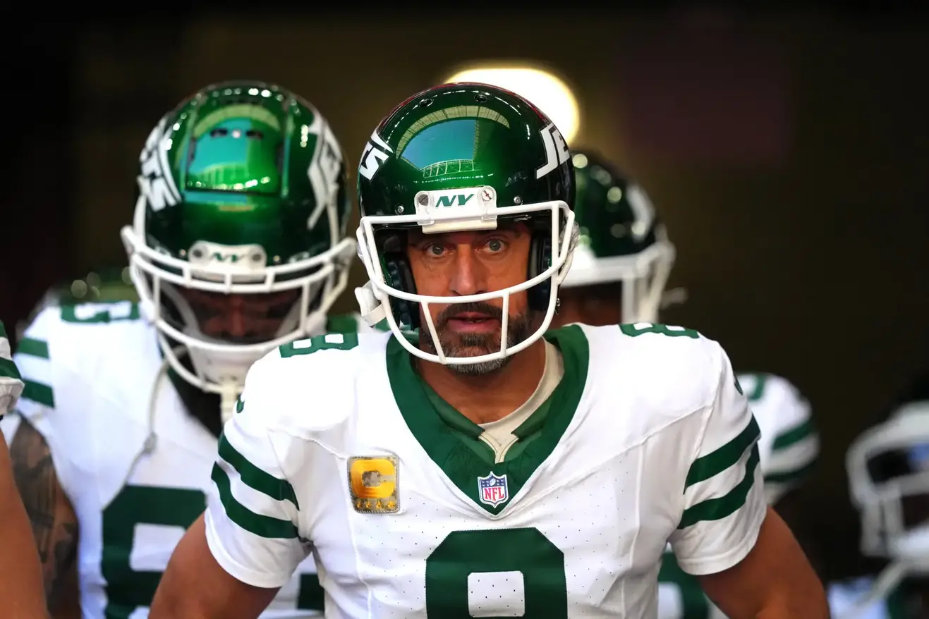 Nov 10, 2024; Glendale, Arizona, USA; New York Jets quarterback Aaron Rodgers (8) warms up before the game against the Arizona Cardinals at State Farm Stadium. Mandatory Credit: Joe Camporeale-Imagn Images