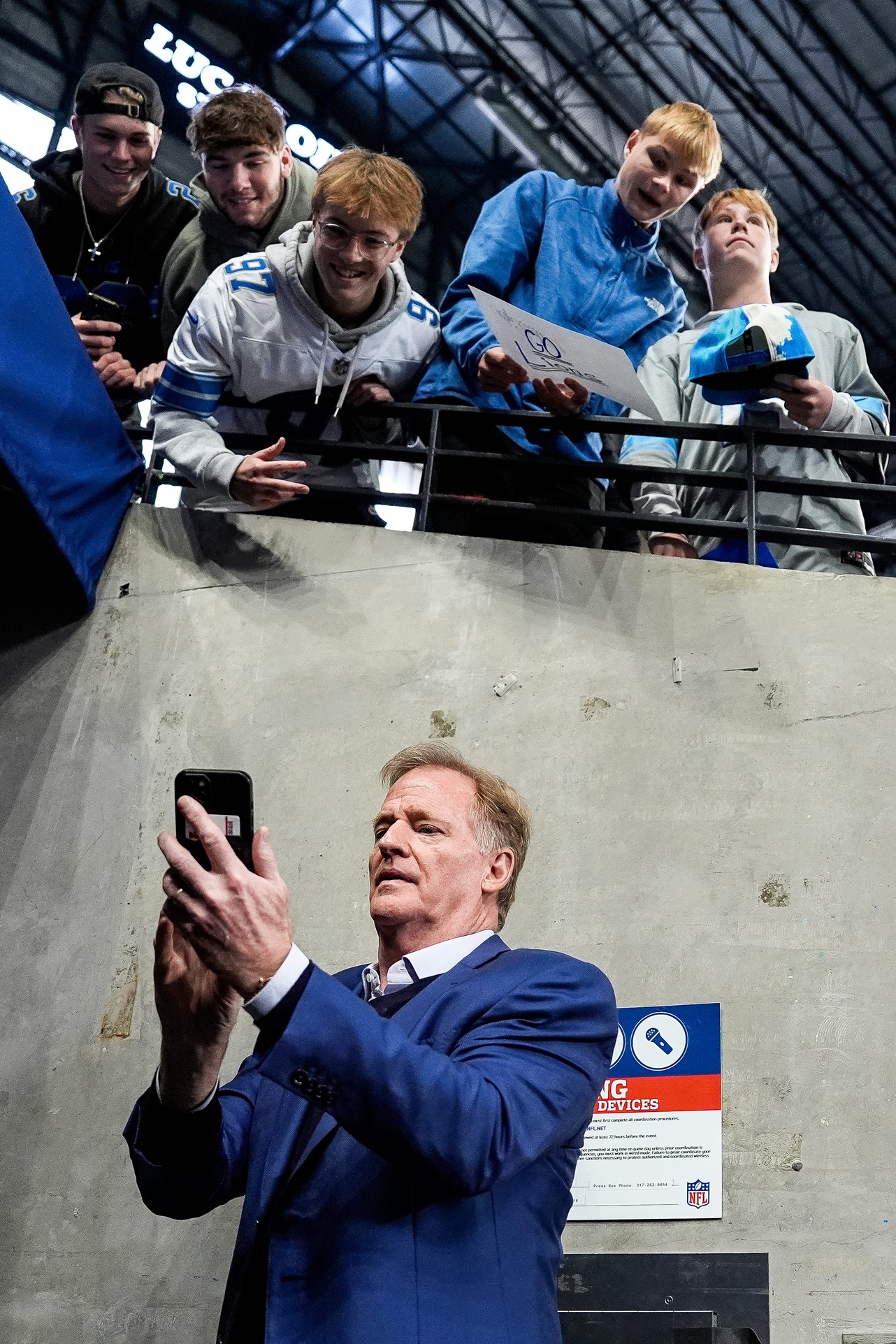 NFL commissioner Roger Goodell takes a selfie with Detroit Lions fans before the game between Indianapolis Colts and Detroit Lions at Lucas Oil Stadium on Sunday, Nov. 24, 2024. © Junfu Han / USA TODAY NETWORK via Imagn Images