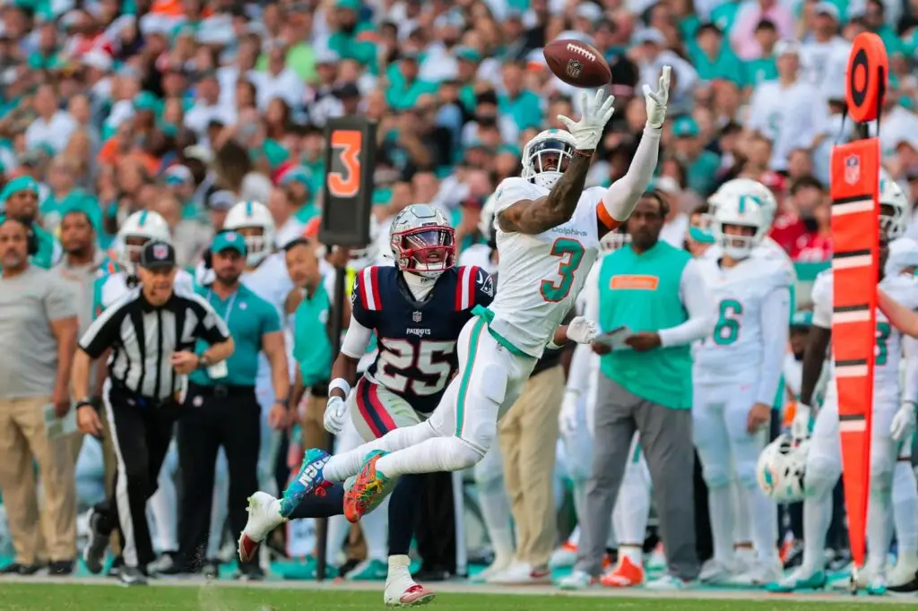 Nov 24, 2024; Miami Gardens, Florida, USA; Miami Dolphins wide receiver Odell Beckham Jr. (3) dives but cannot make a catch against New England Patriots cornerback Marcus Jones (25) during the third quarter at Hard Rock Stadium. Mandatory Credit: Sam Navarro-Imagn Images